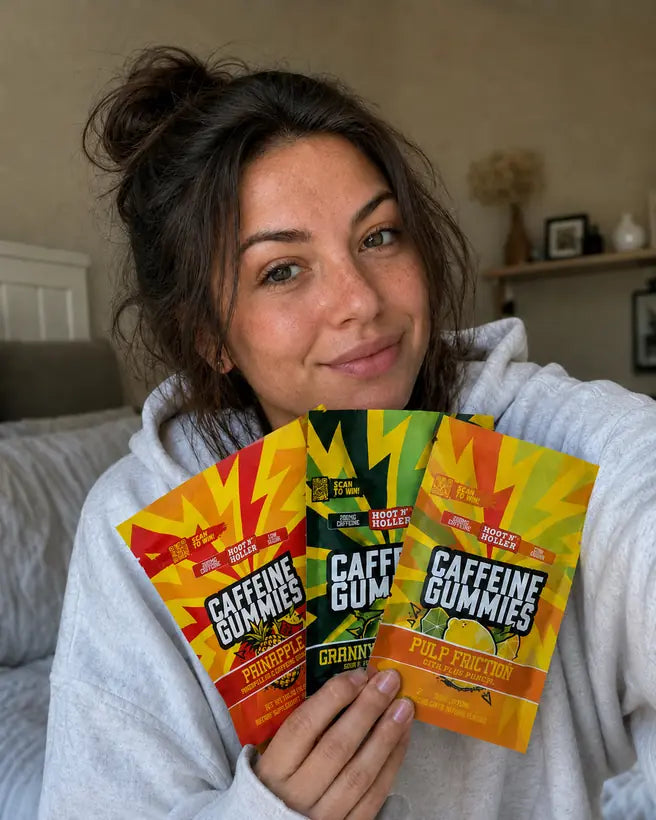 Three bags of Hoot N' Holler caffeine gummies: Painapple, Granny's Revenge and Pulp Friction